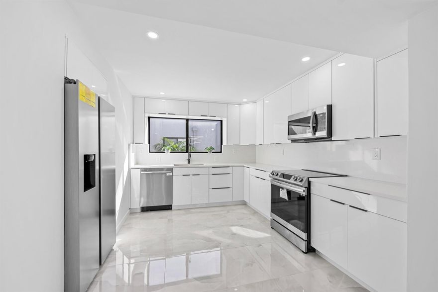 Gorgeous and fully remodeled 2-bedroom, 2-bath condo with den/office (or optional 3rd bedroom) in the desirable 55+ Lakes of Delray community, Pembridge E section. This 2nd-floor unit with lift access features elegant porcelain floors, recessed lighting, and a spacious kitchen with abundant cabinetry and stainless steel Samsung appliances. Both bathrooms offer stunning oversized showers. Enjoy peaceful canal views from the front and relax near the satellite pool. Includes stacked washer/dryer and furniture negotiable. Gated community with pickleball, tennis, gym, library, theater, and more--just 15 minutes to the beach!