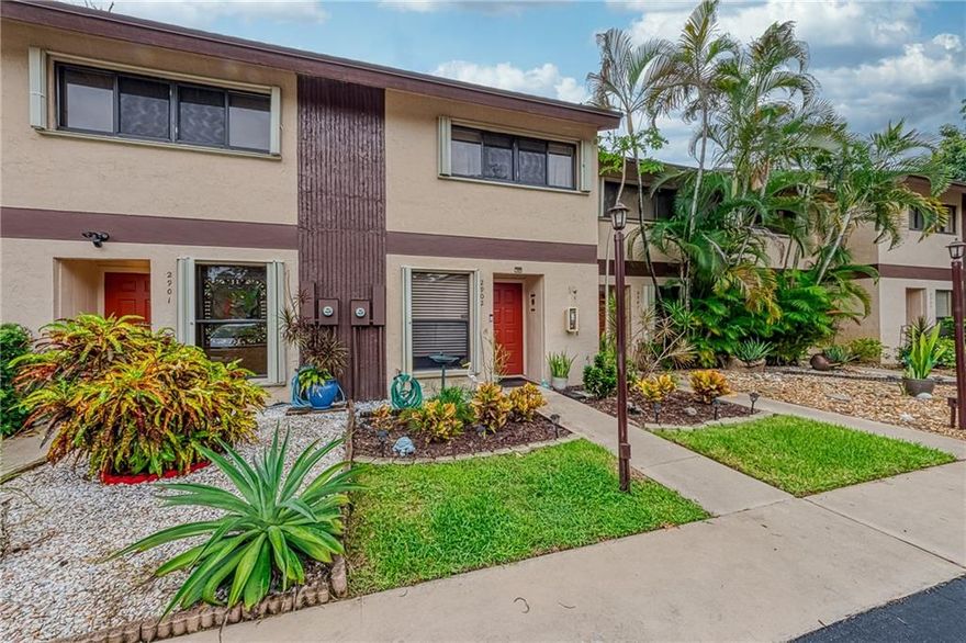 Spacious townhouse in sought after gated Pines West complex! 2 bedrooms with 2 full baths & 1 half bath! First level has kitchen with large window, ample cabinet space & large pass through to dining area. Convenient half bathroom near kitchen, tile flooring throughout the first level. Wide living room has ample space plus room for a large table in dining area. HUGE rear patio with walls on each side for privacy, this unit backs up to the Oakland Forest recreational area. Upstairs has laminate wood floors, very spacious master bedroom and bathroom, laundry in the hallways between the bedrooms and 2nd bedroom has an ensuite bathroom as well with updated shower. 100% hurricane protection, newer windows & accordian shutters, newer w/d, 2017 roof & 2016 a/c. Gym, heated pool, lushly landscaped.