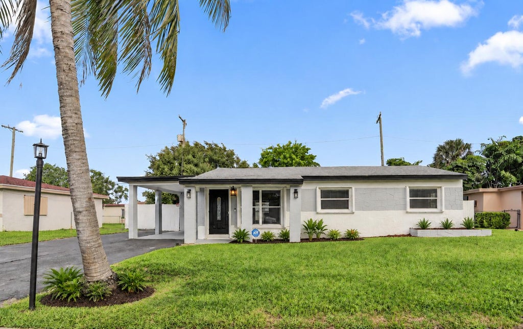 Photo of 3851 NW 4TH Place, Lauderhill, FL 33311 (MLS # B26090810)
