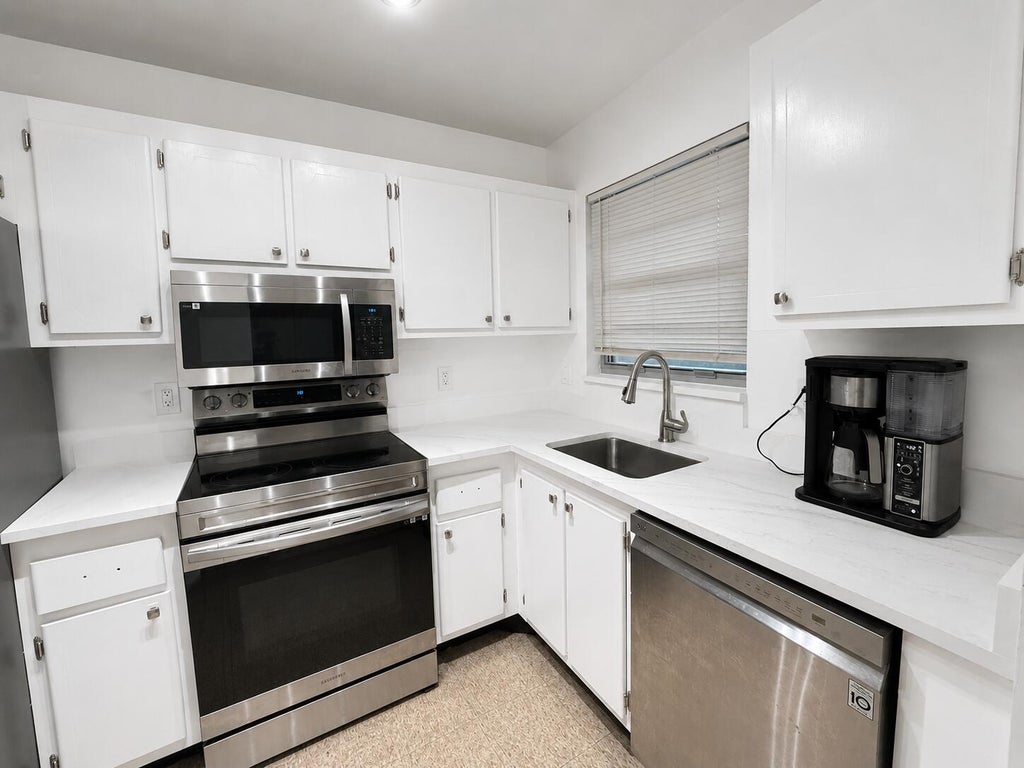 Photo of 1630 EMBASSY Drive #309, West Palm Beach, FL 33401 (MLS # B26067675)