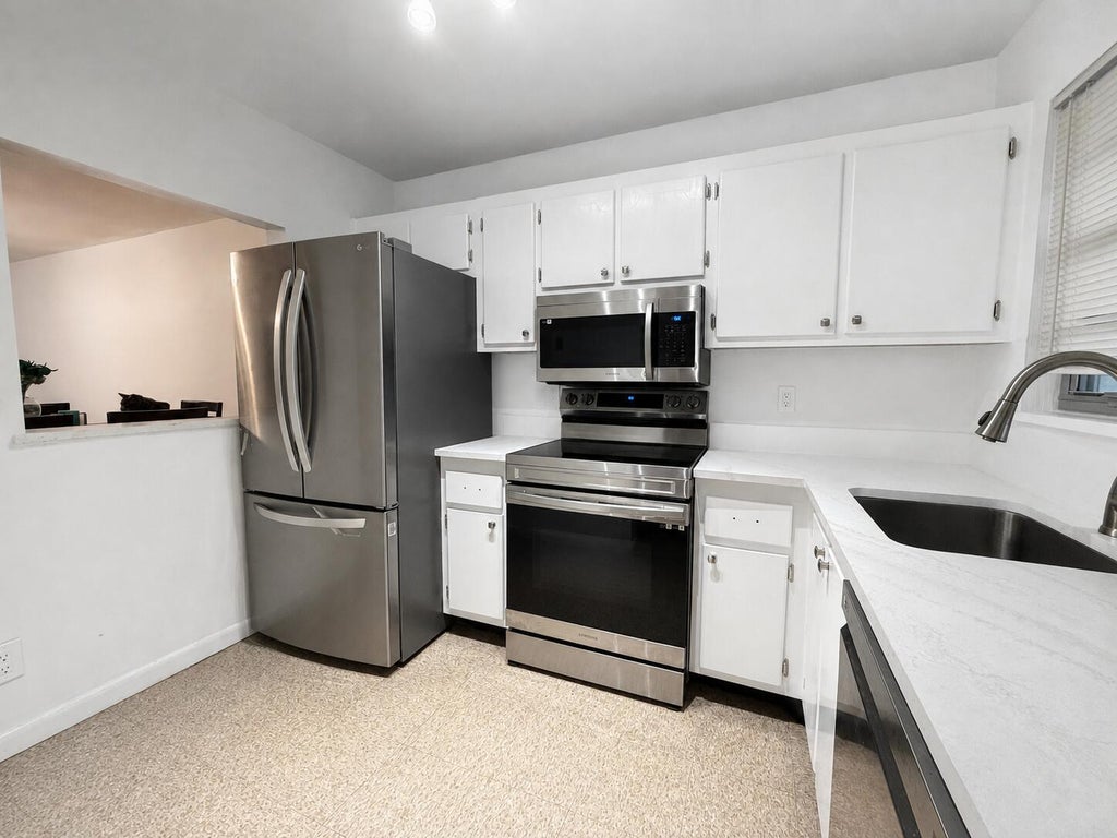 Photo of 1630 EMBASSY Drive #309, West Palm Beach, FL 33401 (MLS # B26067675)