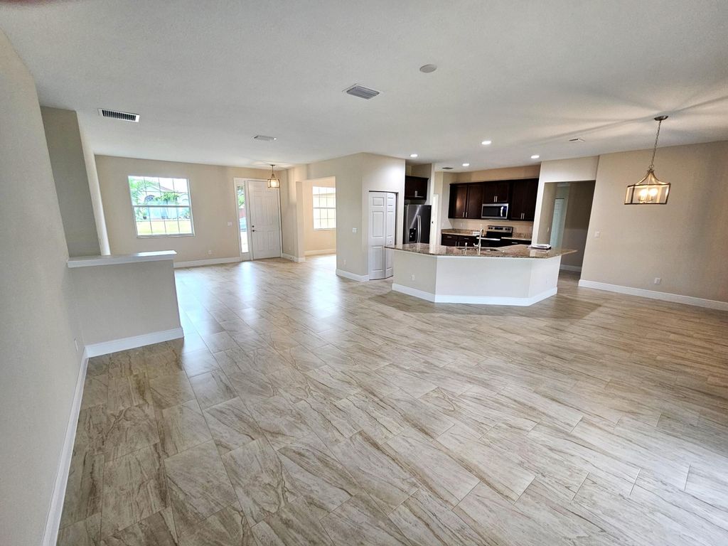 Photo of 1562 SW Santander Avenue, Port Saint Lucie, FL 34953 (MLS # R10980831)