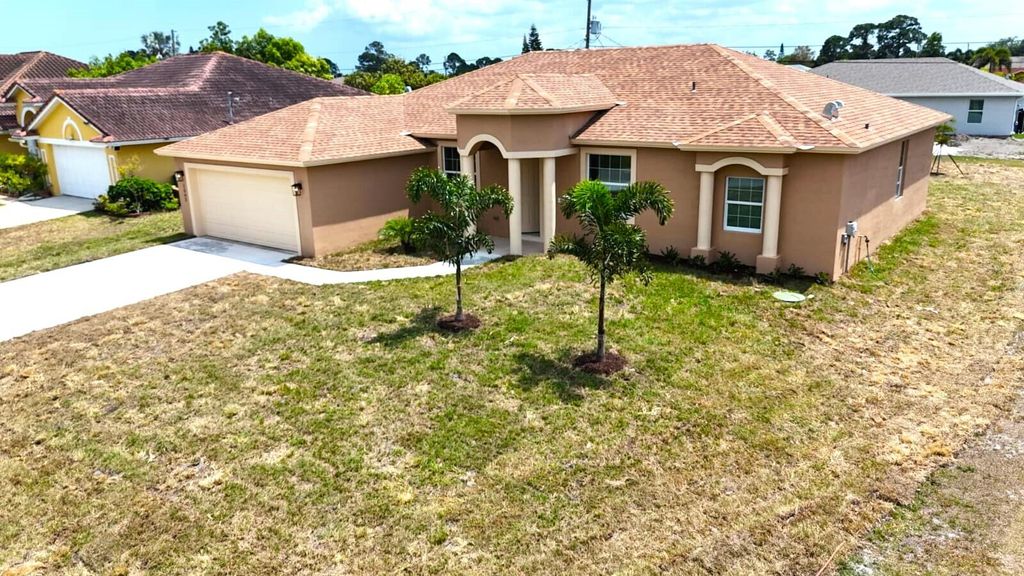 Photo of 1562 SW Santander Avenue, Port Saint Lucie, FL 34953 (MLS # R10980831)