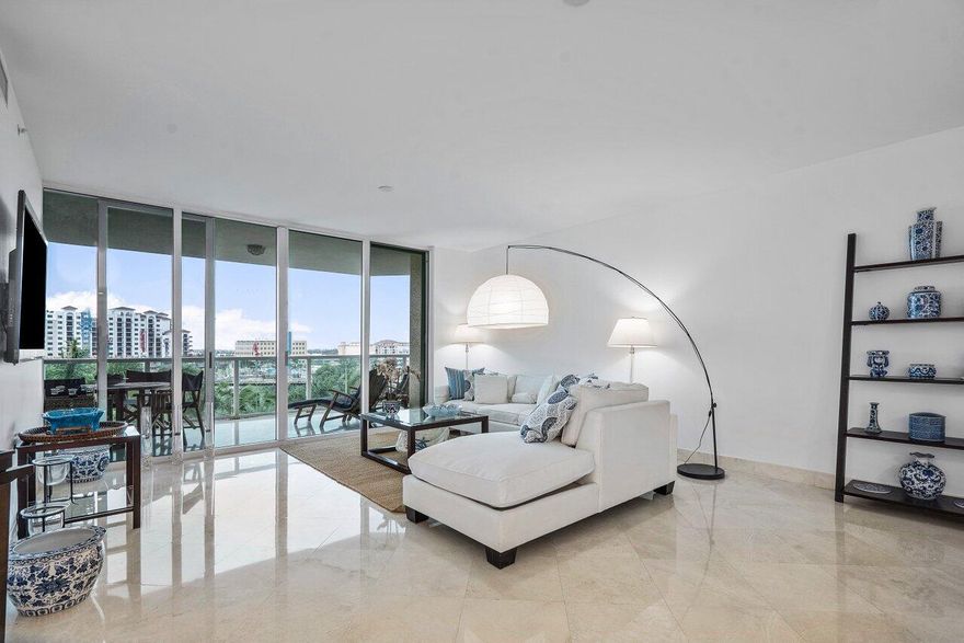 FABULOUS OPEN CONCEPT 2 BEDROOM (1,770 TOTAL Sqft.) THE ENCLOSED DEN IS SET UP AS A SECOND BEDROOM. IT'S RENTED FURNISHED. Located on the 7th floor of Townsend Place, facing south, this very spacious condo features 9-foot ceilings. an expansive glass balcony, accessible from the living and the master bedroom, with decorative glass railings allowing for nice golf course and city views. Floor-to-ceiling glass windows and sliders are solar-tinted and impact resistant. Open remodeled kitchen with an eating island and white quartz counter top, stainless steel appliances, The spacious master suite features his and hers closets, and a sumptuous master bathroom with dual sink vanity, spa tub, and separate seamless glass enclosed marble shower. Townsend Place is your lifestyle dream in one of Boca Raton's downtown premier condominium communities. Perfectly located in the heart of downtown, between the Boca Raton Resort and Royal Palm Plaza, a world-class shopping, and dining area. Walking distance to Mizner Park and the beautiful Boca Raton beach. An international destination served by three airports including the executive Boca Raton Airport. Townsend Place provides a shipping and receiving department, trash chutes, covered and secured parking garage, fire sprinkler system throughout the building, elegantly appointed lobby, social room with card tables, catering kitchen, billiards, lounge, two brain new state-of-the-art fitness facilities with men's and women's sauna and steam room. The magnificent swimming pool area features a sun deck with lounge chairs and Jacuzzi, all overlooking the Boca Resort golf course. This full-service luxury building presents all the signs of quality and class, concierge service, a manager on site, valet parking, round-the-clock security, 24-hour gate-manned entrance. Don't wait! Get ready for a 5-star lifestyle.