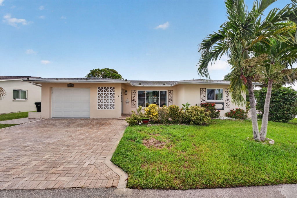 Photo of 4716 NW 49TH Place, Tamarac, FL 33319 (MLS # B26058822)