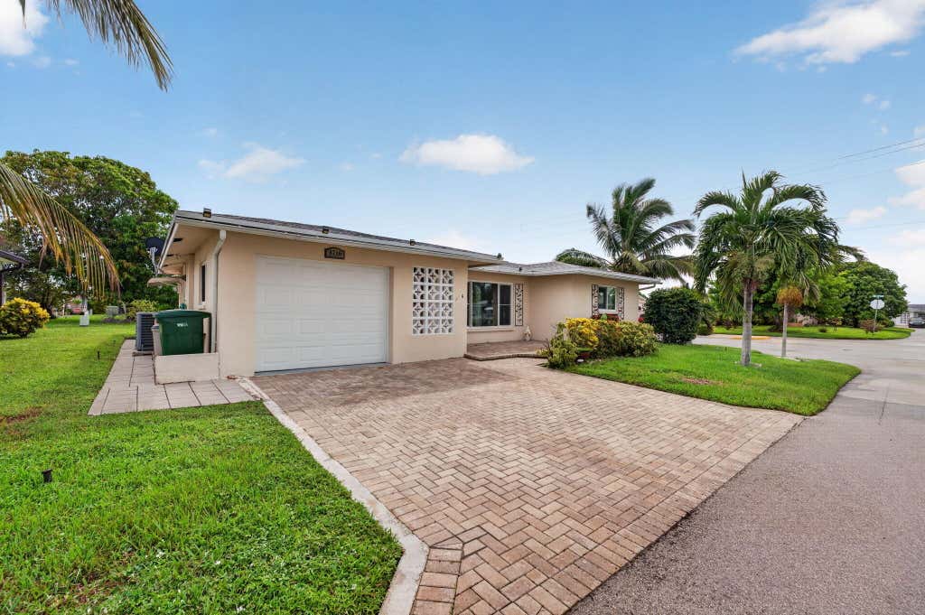 Photo of 4716 NW 49TH Place, Tamarac, FL 33319 (MLS # B26058822)