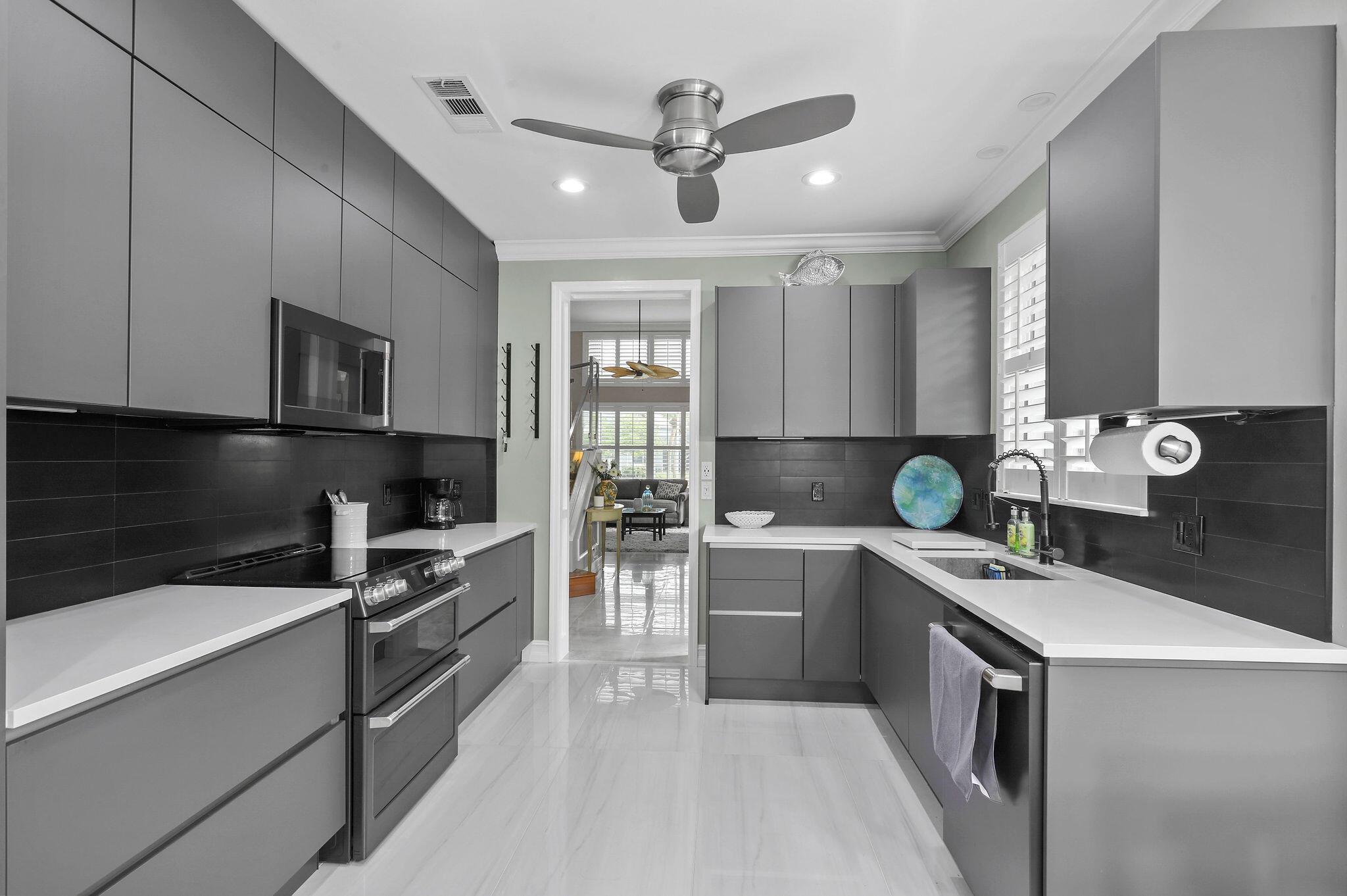 Spacious and inviting townhome in Jupiter's highly desirable Sea Colony community, steps from the beach. Boasts an updated kitchen, 2 car garage, lake views, and an abundance of waterfront outdoor living! Amenity rich community with a stellar location. Available with flexible dates for season 2026. 30 day minimum. Unavailable 12/25/25-1/10/26. Tenant responsible for 13% bed tax.
