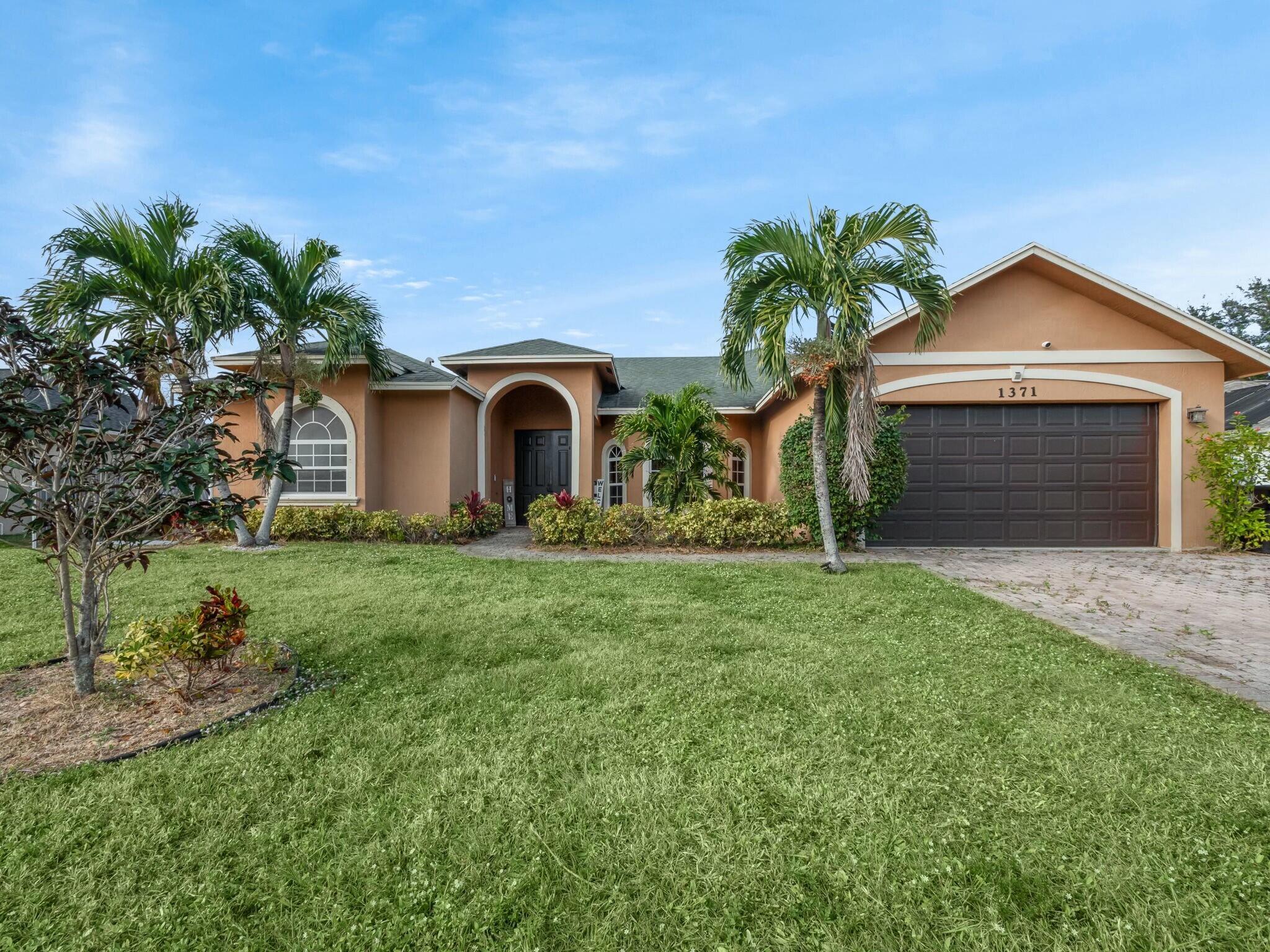 Welcome to your dream home in Port St. Lucie! This stunning four-bedroom, three-bathroom gem offers a perfect blend of elegance and comfort. As you step inside, you'll be greeted by an open, airy floor plan with exquisite finishes and abundant natural light. The spacious living area is ideal for both relaxation and entertaining, while the modern kitchen features high-end appliances and ample counter space. Each bedroom provides a serene retreat, including a luxurious master suite with a spa-like en-suite bathroom. Enjoy outdoor living in your beautifully landscaped backyard, perfect for gatherings or quiet moments. This home is meticulously maintained and showcases both style and functionality. Don't miss the chance to experience it for yourself--schedule a tour today!