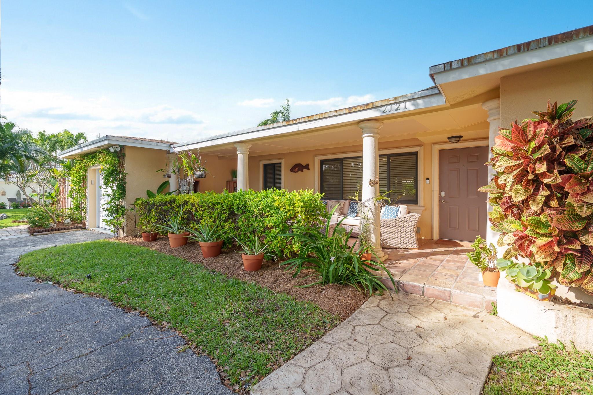 Move In Ready! Fully Furnished home beautifully decorated with 3 spacious bedrooms. Main suit has king size bed and all other bedrooms have queen beds. 2 Full bathrooms and 1 half bath for guests. Covered porch to enjoy your morning coffee or evening cocktail, backyard with lush landscaping, patio setting and sparkling pool. This home features a custom bar and laundry room with built in cabinetry for extra storage. Large living area and open kitchen with snack counter and tons of natural light. One car garage for a car and storage. Quiet upscale neighborhood with close proximity to shopping, dining entertainment and Lighthouse Point Marina & beach area blocks away.