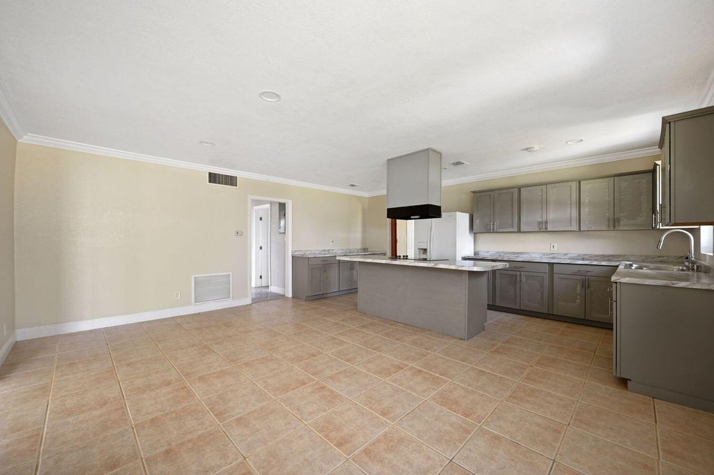 Photo of 308 NW Avenue H Place, Belle Glade, FL 33430 (MLS # R10901989)