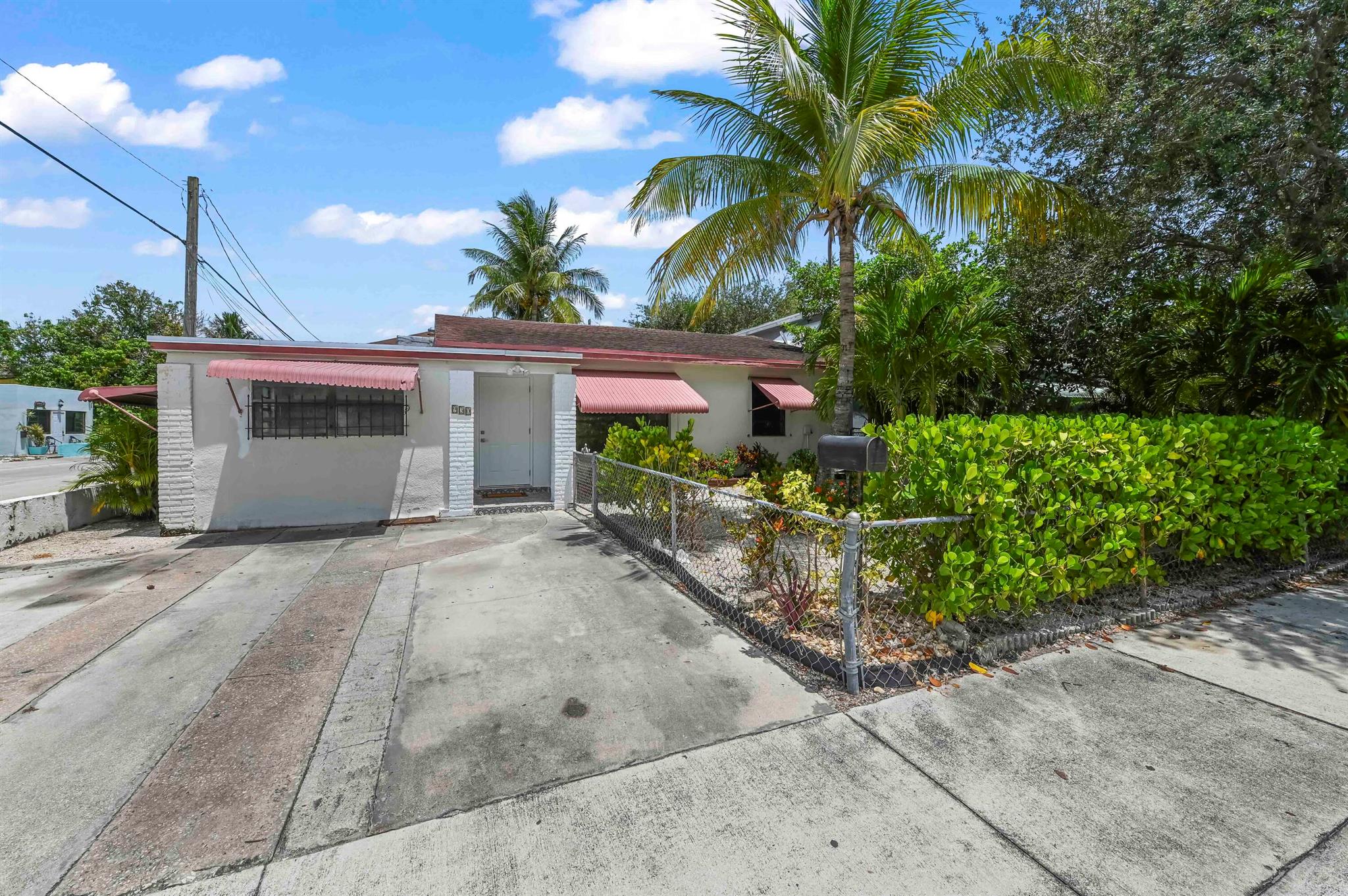 Built in accordance with superior design principles and dedicated attention to detail, this newly enhanced abode is located at 930 North K Street in the beautiful locale of Lake Worth Beach, Florida. The residence presents as an outstanding choice for individuals seeking a property which combines aesthetic highlights with functional features.Elegantly renovated to perfection, it retains its timeless charm, while seamlessly infusing modern luxuries. The central living area is open and inviting, offering a prime setting for entertainment or tranquility, that adapts to the individual needs of the resident. Adjacent to this primary space is a large, well-appointed kitchen, ambitiously designed to cater to culinary pursuits: casual weeknight dinners, grand holiday feasts, or catered soirees.