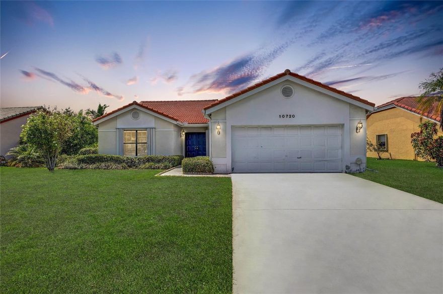 Discover this charming 3-bedroom, 2-bathroom CBS construction home in the lovely 55+ Isles of Tamarac community. This well-maintained property boasts tall vaulted ceiling over a spacious living/dining room area, perfect for entertaining or relaxing. The kitchen features ample storage, a cozy dining space, and direct access to a spacious screened in and patio, overlooking a lush private backyard. The primary suite offers a peaceful retreat with an en-suite bathroom and generous, walk-in closet. Additional highlights include accordion shutters for storm protection, a newer water heater, and brand-new plumbing throughout. Stay friendly!