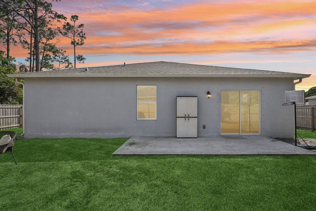 Photo of 1561 SW Latshaw Avenue, Port Saint Lucie, FL 34953 (MLS # R11156999)