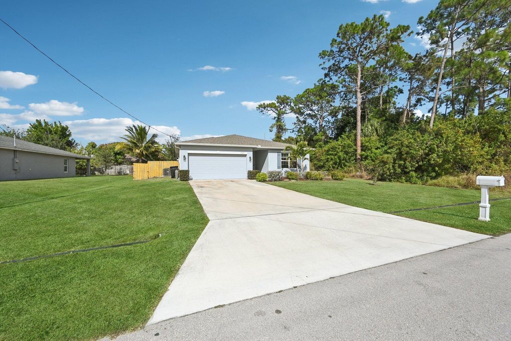 Photo of 1561 SW Latshaw Avenue, Port Saint Lucie, FL 34953 (MLS # R11156999)