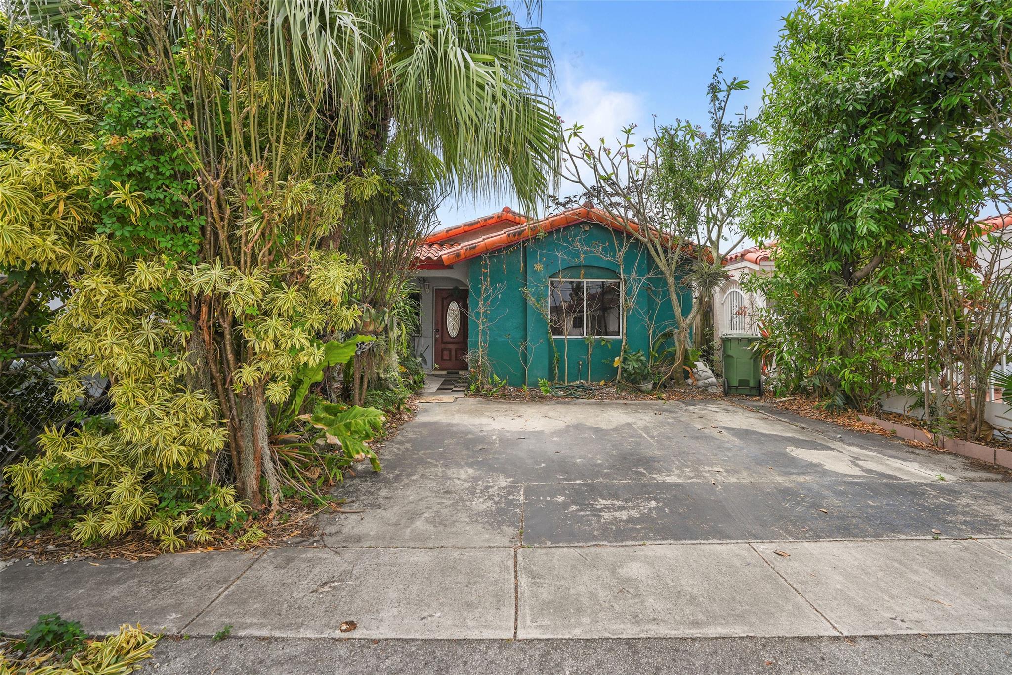 Welcome to this charming 3-bedroom, 2-bathroom single-story home, NO HOA ideally located in one of Hialeah’s most convenient areas. Just a short walk to Carl Slade Park, Publix Supermarket, and the highly rated Hialeah Gardens Middle School (Grade A). The home features a newer roof (2014), impact-resistant windows and doors throughout, and an AC compressor installed in 2019. The water heater dates back to 2003. While the interior could use some updates and TLC, the potential is undeniable. Please review all interior photos for details. Fresh exterior paint has just been completed. Perfect opportunity for investors or first-time homebuyers!