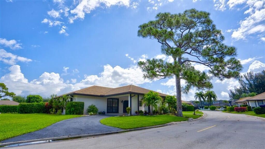 Photo of 429 Pine Villa Drive, Atlantis, FL 33462 (MLS # B26029592)