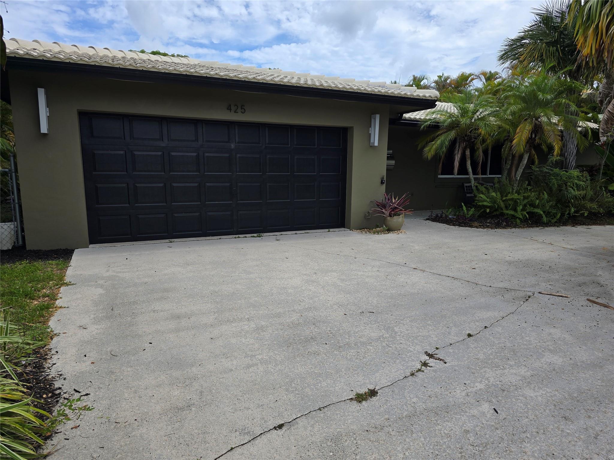 This 2,200 sq ft home under air offers 4 bedrooms and 2 bathrooms, with a spacious layout including a large living room, family room, and flexible office/play area that can also serve as a second dining space. The attached garage provides convenience, while the fully fenced yard features lush landscaping in both the front and back. Located in desirable West Wilton Manors, just minutes from the beach and I-95.