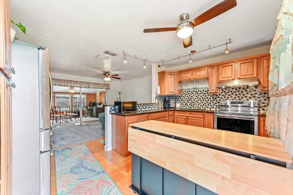 Photo of 5709 SE Indigo Avenue, Stuart, FL 34997 (MLS # R11159272)