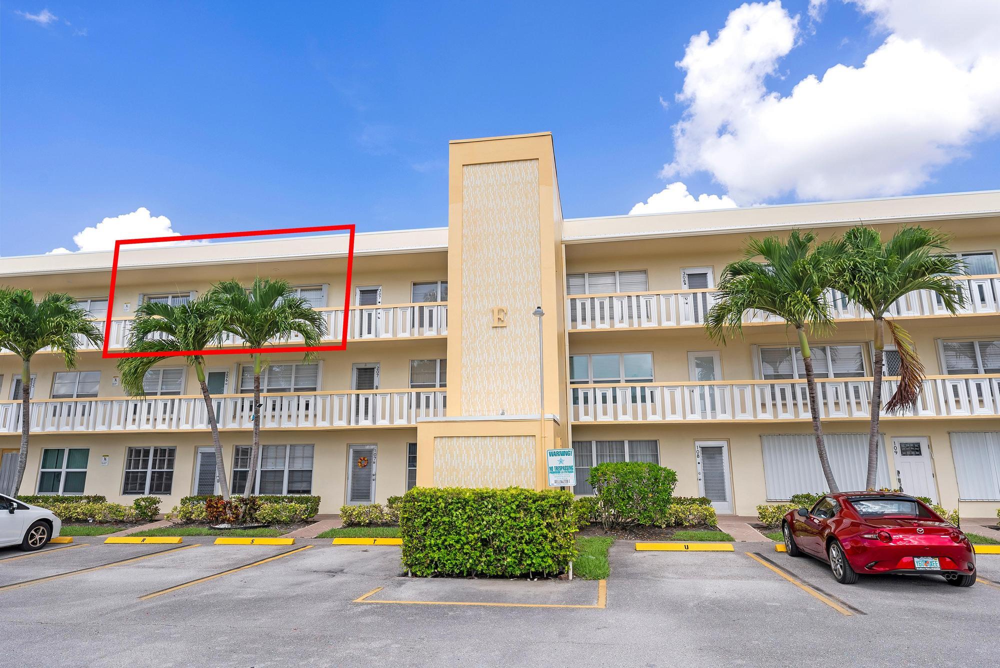 Beautiful water views abound in this spacious third-floor, 2-bedroom, 2-bath condominium located in the luxury Wellington section of Century Village (55+ community). The unit offers a generously sized living room with an adjacent mirrored dining area that opens to a kitchen featuring an island. The primary bedroom suite presents waterfront vistas, a full ensuite bath, and a large walk-in closet. Residents can enjoy additional space and scenic views from the enclosed lanai, highlighted by neutral tile flooring throughout. Impact windows are installed in both the lanai and front door. Wellington E is pet-friendly building offering extra reserves, additional storage, elevator access, trash chutes, and two exclusive resident pools...