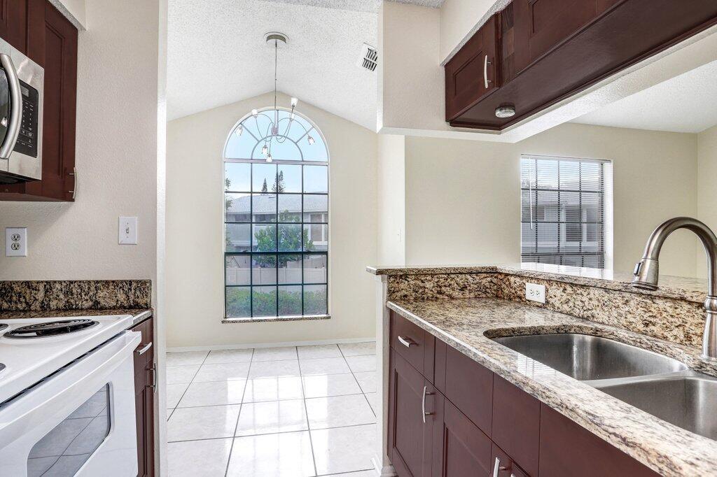 Come Home to this 1 Bedroom 2nd Floor Condominium in The Grand Reserve Gated Community. Private covered Patio overlooking Peaceful Beautiful Green Foliage. Enjoy the resort-style amenities including the pool, spa, fitness center, tennis courts, clubhouse & more with no Membership Fees!