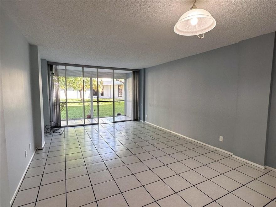 First floor 1 bedroom, 1.5 bath ready for your personalized touch. Impact windows in bedroom, baths and kitchen. Roll down shutter on screened patio. White tile in living area, berber carpet in bedroom. Original baths freshened up in 2018. New water heater and AC in 2018. New appliances in 2018. Screened patio faces northwest with view of grounds and canal. Royal Park Condos has 3 heated pools, exercise rooms, car wash area, BBQ areas, clubhouse, and laundry rooms on ground floor in each building. Gated/secure entry. 2 pets permitted per unit with no weight restrictions. Must own 2 years before leasing.  Ample guest parking. Close to Wilton Manors, downtown, beaches, shopping & transportation. Easterlin Park, Royal Palm Park and Oakland Bark dog park within walking distance outside gate.