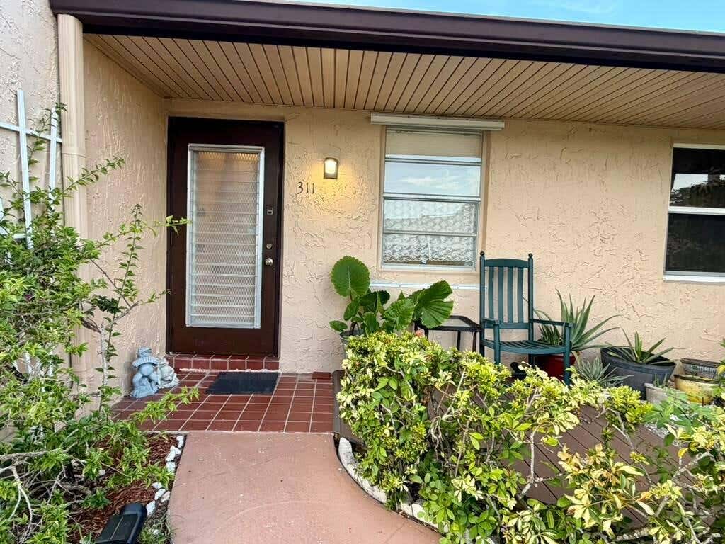 Photo of 311 GOLDEN RIVER Drive, West Palm Beach, FL 33411 (MLS # B26068249)