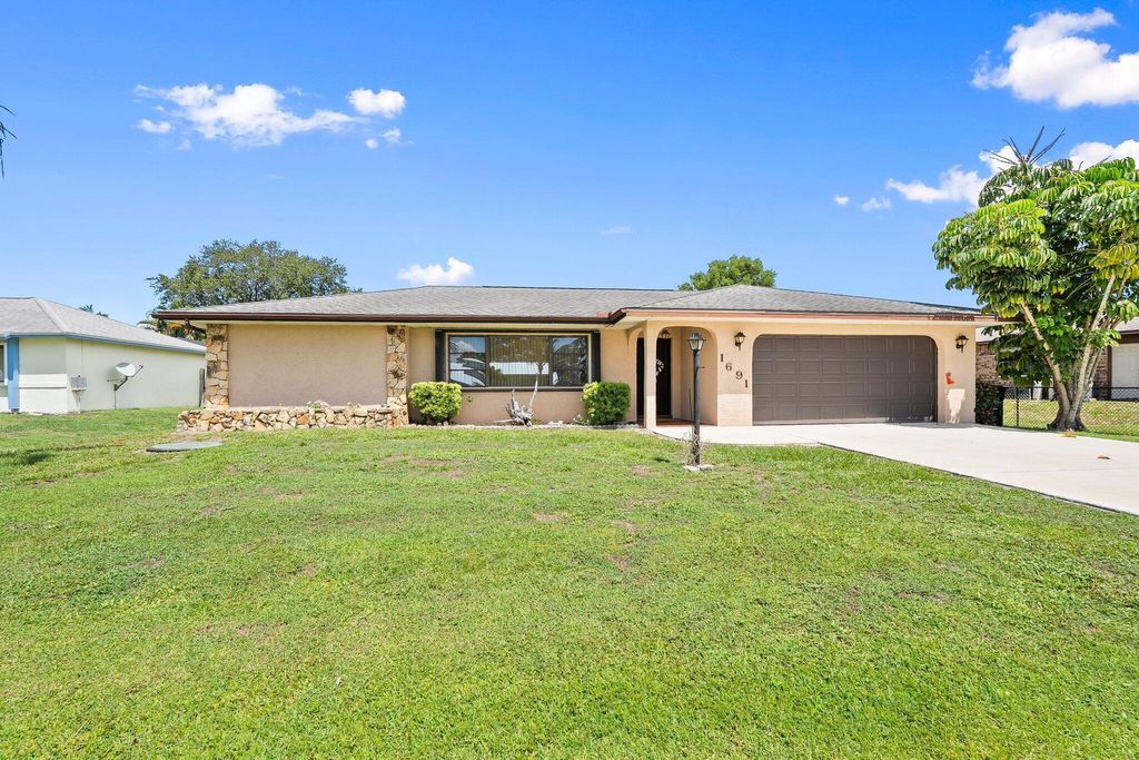 Photo of 1691 SE Mistletoe Street, Port Saint Lucie, FL 34983 (MLS # R11104235)