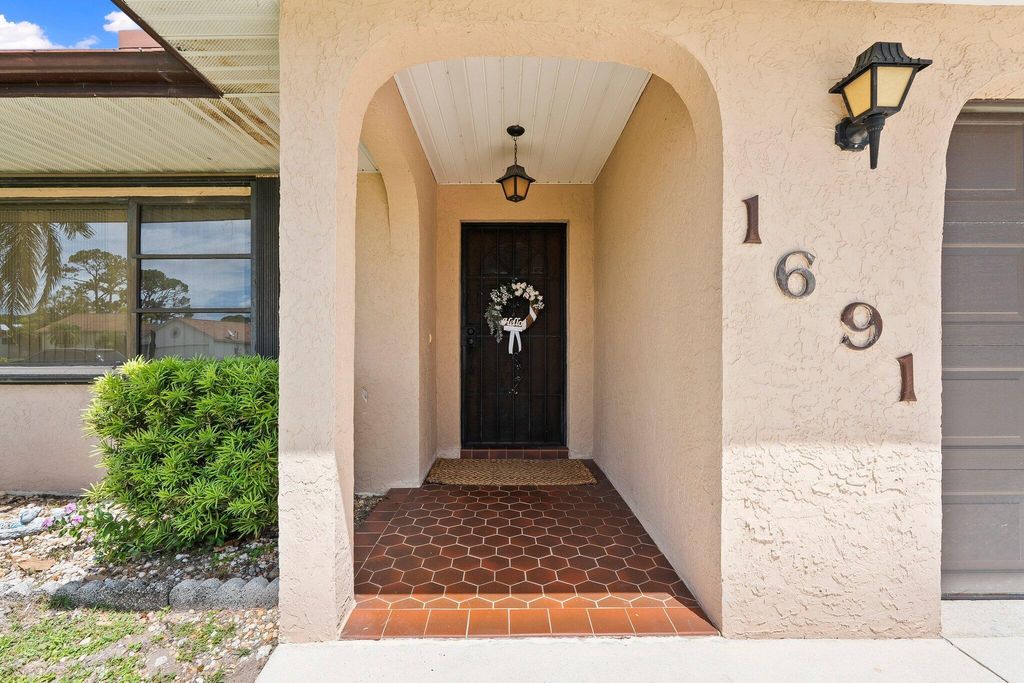 Photo of 1691 SE Mistletoe Street, Port Saint Lucie, FL 34983 (MLS # R11104235)