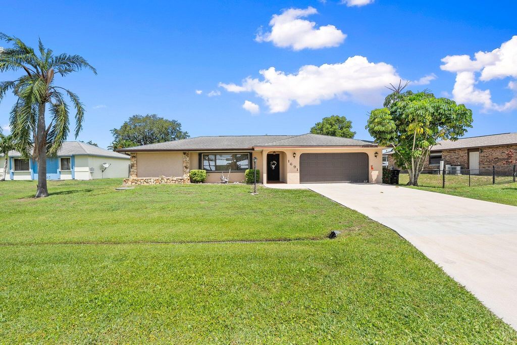 Photo of 1691 SE Mistletoe Street, Port Saint Lucie, FL 34983 (MLS # R11104235)