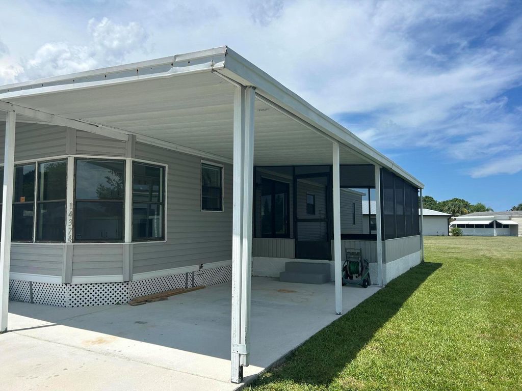 Photo of 14374 Cancun Ave, Fort Pierce, FL 34951 (MLS # R11107064)