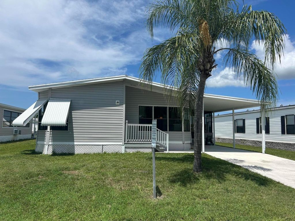 Photo of 14374 Cancun Ave, Fort Pierce, FL 34951 (MLS # R11107064)