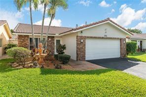 Stunning 4 BEDROOM HOME that has been Professionally Converted to 3 HUGE Bedrooms! Kitchen boasts Newly Re-Modeled Island Kitchen w/CUSTOM CHERRYWOOD CABINETS, Granite Countertops and SS Appliances! Dining Room/ Living Room has Sliding Glass Doors Overlooking the GIANT Covered Screen Patio and Sparkling POOL! Vaulted Ceilings and Light Gray Laminate Floors lend to the Bright and Open Feel of this Stunning Florida Pool Home! Updated Master Suite features a bathroom Skylight, Dual Sinks and a Walk-in-Shower. The Backyard and pool area features a White Vinyl fence and an outdoor Shower! Large 2 Car Garage W/Laundry area and extra Storage! Additional indoor Storage Room off the Patio. New High Efficiency A/C. Newer Water Heater. Must See to Appreciate! Wont Last! SHOWS LIKE A MODEL!