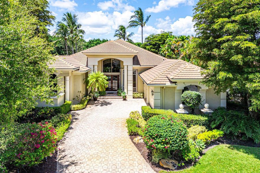 Luxury meets tranquility in this stunning 3,794sf 4-bedroom, 4-bathroom estate, perfectly situated on a prime corner lot at the end of a peaceful cul-de-sac in the prestigious BallenIsles Country Club. Boasting expansive lake views on 2 sides as well as golf views of the 8th hole of the South Course, this residence offers an unparalleled blend of elegance and functionality with a coveted golf membership.The open-concept interior features marble flooring with plush carpet in the primary suite and two of the guest bedrooms. All four bedrooms are ensuite, providing privacy and comfort. Two versatile offices--one originally a dining room--offer flexible spaces for work.The gourmet kitchen is a chef's dream, equipped with a Thermador double oven, Thermador dishwasher, and a 1-year