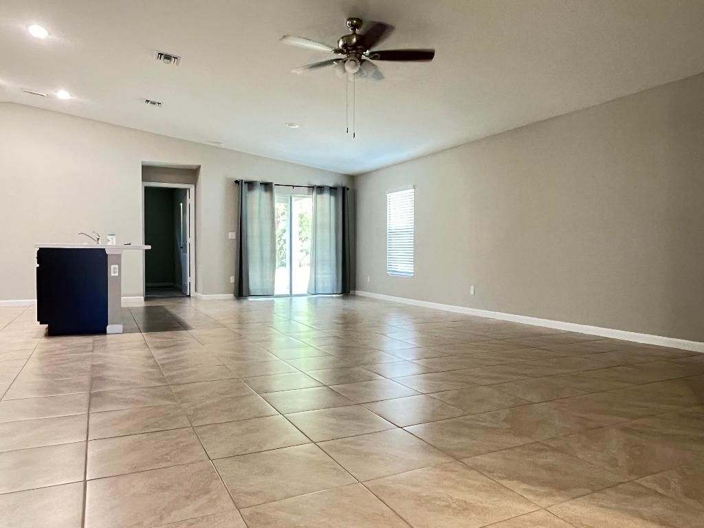 Photo of 1133 SW Ingrassina Avenue, Port Saint Lucie, FL 34953 (MLS # R11143968)