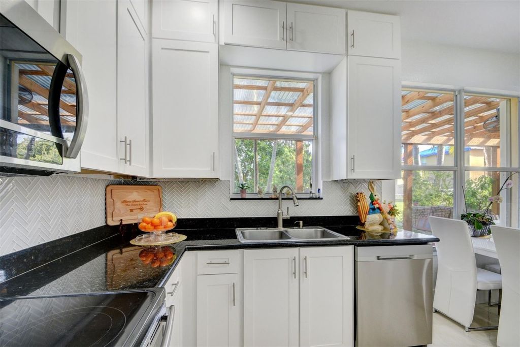 Photo of 5407 Wellcraft Drive, Greenacres, FL 33463 (MLS # F10544767)