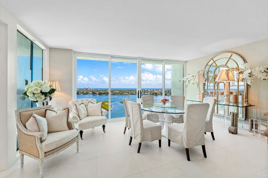 This stylish RENOVATED residence offers east-west exposures, floor-to-ceiling windows with expansive views of the Intracoastal, Palm Beach Island, and Atlantic Ocean. Features include white tile floors, sophisticated bathrooms, impact-resistant windows with white frames, upgraded HVAC and hot water heater & recessed lights. The eat-in kitchen with stainless steel appliances opens to a 9 x 10 dining area on the front balcony. The rear full-length balcony ensures abundant natural light across the entire apartment. The pet-friendly Plaza of the Palm Beaches is a luxury, full-service, concierge building providing manned gated entry, valet parking, two pools, tennis/pickleball court, gym and conference room. Conveniently situated near the Middle Bridge to Palm Beach and all the WPB attractions.