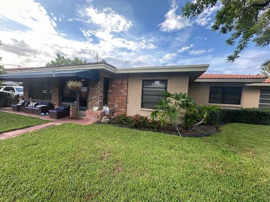 A Florida style home tucked away in a friendly Intracoastal boating neighborhood east of Federal Hwy. & steps from the spillway. This single-family home is on a corner lot, NO HOA, pet friendly neighborhood, fenced yard, Lots of green space and extended patio great for entertaining plenty of room if you would like a pool.  and room to accommodate your boat.  A mile away launch your boat @ the Boynton boat ramp, which is located across from the Boynton Inlet, prime fishing spots, enjoy waterfront . Updated Kitchen with SS appliances and granite counter tops , Barrel roof 4/2003-electric panel 8/2004, awnings 2019 Tile throughout the home, dining & Boynton Beach's up & coming downtown redevelopment,