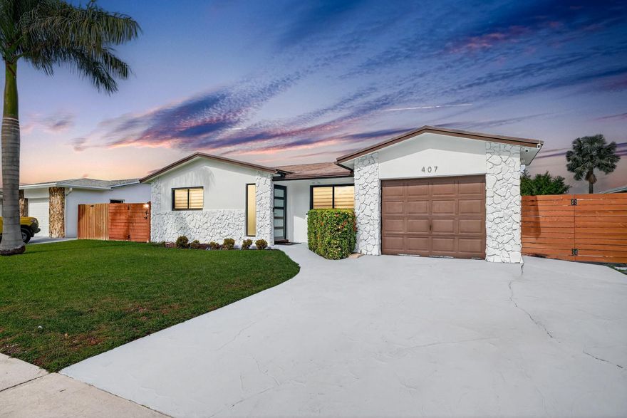 Stunning Modern Home in Prime Dania Beach Location! Beautifully upgraded with new hurricane-impact windows & doors, resurfaced driveway with two separate 2-car/boat parking areas including gated alley access. Enjoy a lush private backyard, dusk-to-dawn lighting, storage shed + generator transfer switch. Inside: washer & dryer included, new tile floors, recessed lighting, electric fireplace, brand-new A/C (2024) with ducts serviced in 2025. Designer kitchen with soft-close cabinetry, quartz counters & stainless appliances. Both bathrooms feature double sinks and high-end finishes. Ventilated garage ideal as office/gym/flex space. Screened patio perfect for entertaining. Unbeatable location, minutes to beaches, airport, Dania Pointe, Las Olas & Hard Rock Hotel.