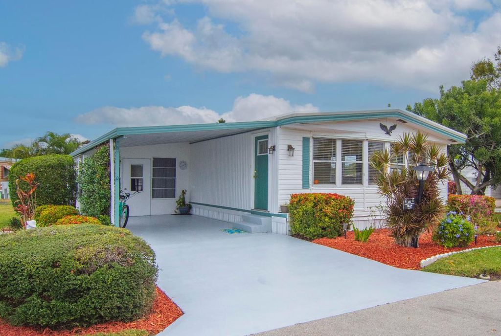 Photo of 452 NE Pinelake Village Boulevard, Jensen Beach, FL 34957 (MLS # R11153827)