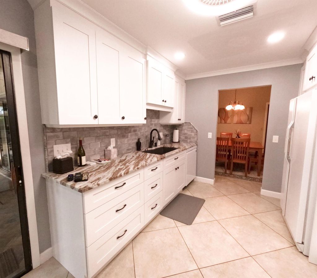 Photo of 7906 SE Trenton Avenue, Hobe Sound, FL 33455 (MLS # R11037360)