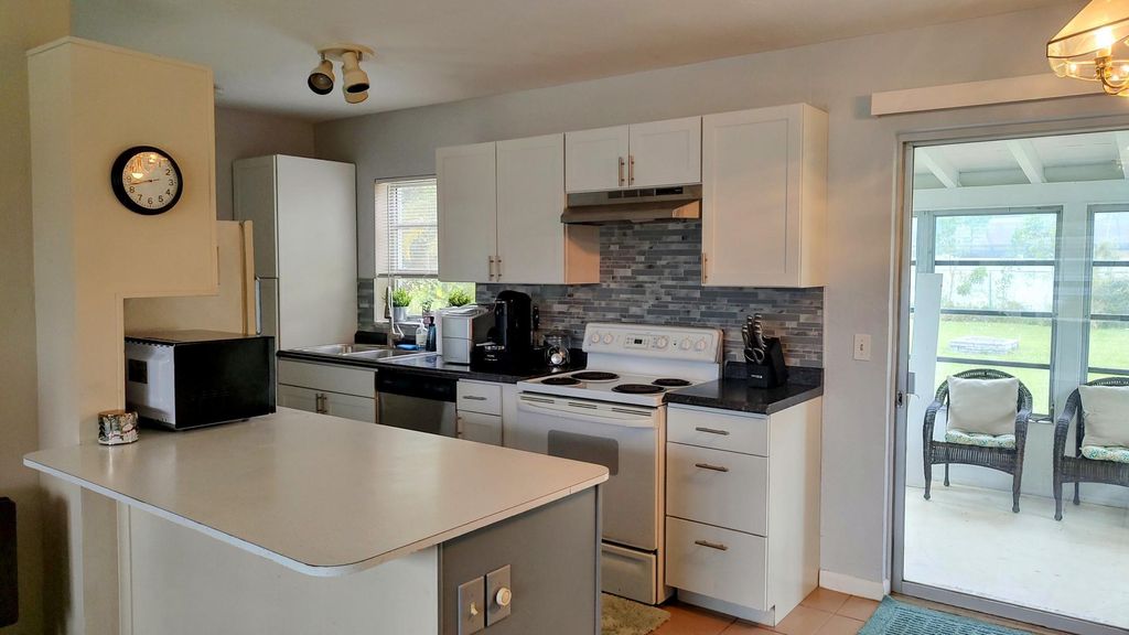 Photo of 763 SE Airoso Boulevard, Port Saint Lucie, FL 34983 (MLS # R10937032)