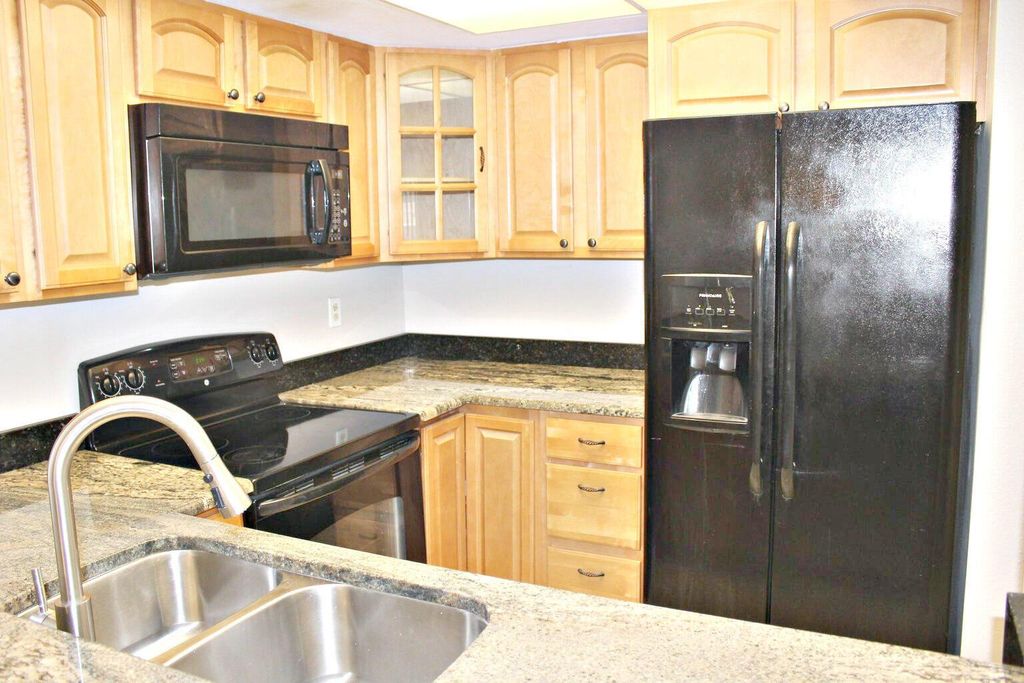 Photo of 1548 SE Royal Green Circle #104, Port St Lucie, FL 34952 (MLS # R10934285)