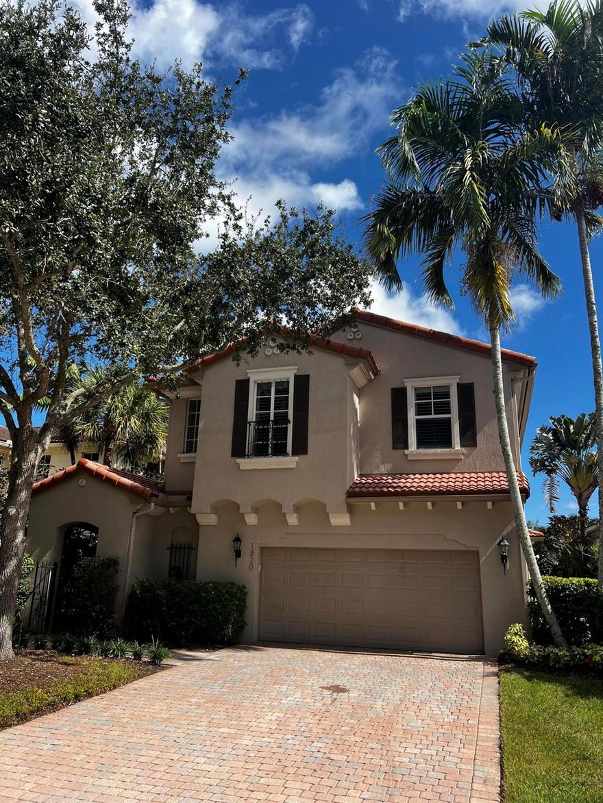 Welcome to 1820 Flower Drive, an elegant 3 bedroom, 2.5-bath lakefront residence located in the prestigious gated community of Evergrene in Palm Beach Gardens. This beautifully updated home offers an open, light filled layout with volume ceilings, wood and tile flooring, and expansive lake views throughout. The chef's kitchen features white cabinetry, gas cooking, and a center island flowing seamlessly to the living and dining areas. Upstairs, a flexible loft space and a serene primary suite with private balcony provide comfort and tranquility. Step outside to a heated pool and spa with screened patio overlooking the lake perfect for entertaining or relaxing in privacy.Residents of Evergrene enjoy 24 hour manned security, a resort-style clubhouse with infinity-edge pool and Tiki Bar,