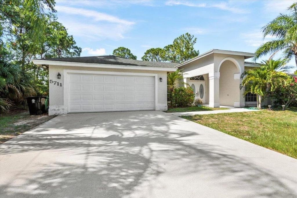 Photo of 5711 NW Zenith Drive, Port Saint Lucie, FL 34986 (MLS # R10997201)