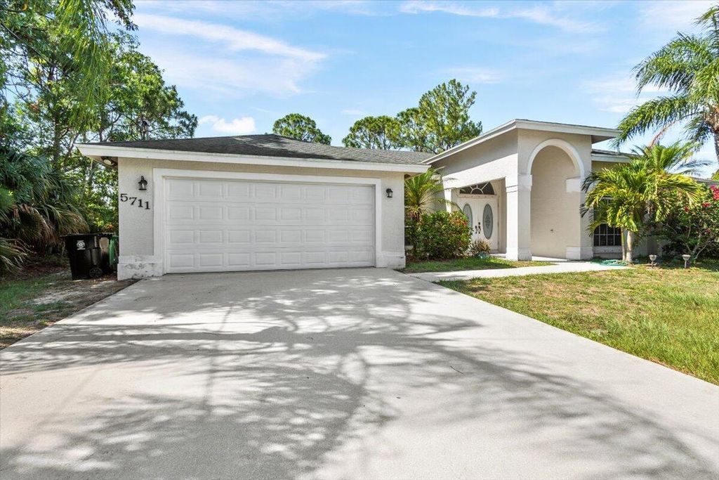 Photo of 5711 NW Zenith Drive, Port Saint Lucie, FL 34986 (MLS # R10997201)