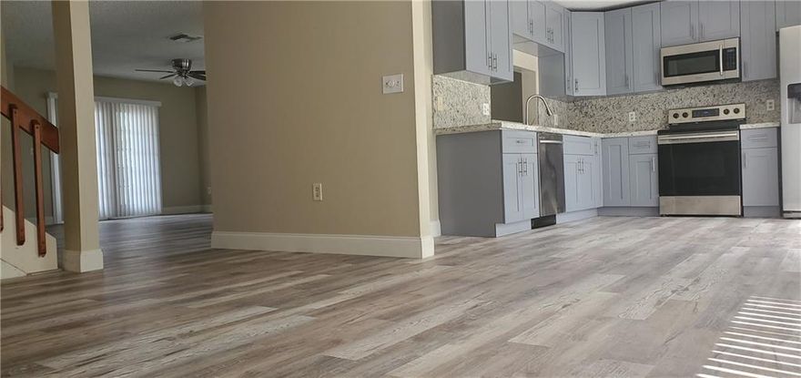 Absolutely stunning like new Pembroke Pines home. Roof is 1 month new good for another 30 years, new modern grey kitchen with new granite countertops and backsplash. New floors, new bathrooms with porcelain tiles. Brand new washer and dryer. All stainless steel appliances are like new. New AC unit and air handler. This is an amazing find in this market. Low hoa fees in a well kept community. Fenced yard with fruit trees, lots of room for a pool. The home is situated close to shopping near the Mall and City center in the quiet neighborhood of Lakeside Key. Perfect for a large family with large dogs. Large side gate wide enough to park a recreation vehicle or your wave runner. An amazing find, run do not sleep on this one. Pride of ownership.