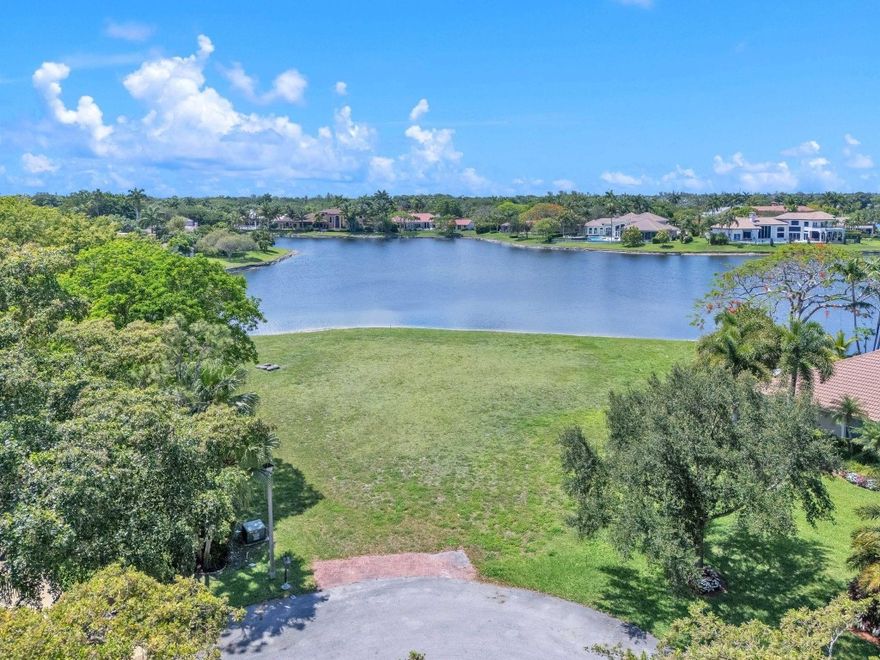 Last opportunity to build your dream home on the largest Vacant waterfront lot available in the heart of Parkland. This exceptional property offers breathtaking water views with .265 feet of water frontage. Located in the prestigious Cypress Head community, residents enjoy resort-style amenities including a clubhouse, pool, fitness center, pickleball courts, and a gated community, all with low HOA fees. The lot includes a soil test, survey, and a permitted set of architectural drawings with an accredited offer. Convenient access to major roads and highways, shopping, beaches, malls, and A+ rated schools.