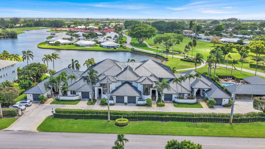 A rare opportunity to experience Private Golf Course Living with Custom Design & Exceptional Upgrades, this fully customized, light filled residence offers the scale, privacy, and livability of a single-family home, all within an intimate boutique building in the highly sought-after City of Atlantis.   Thoughtfully reimagined and extensively renovated, the home blends timeless finishes with modern functionality while overlooking a premier golf course setting on the No. 2 tee box of the East Course at Lost City Golf Club. The residence features two bedrooms, two and a half bathrooms, along with two additional spaces thoughtfully incorporated into the redesigned floor-plan a private den and a dedicated office creating a level of flexibility rarely found. From the moment you enter,  expansive, light-filled living spaces unfold, designed for both everyday comfort and effortless entertaining. Warm wood flooring flows throughout the main living areas, complemented by elegant marble in the foyer and primary bath, while custom millwork, upgraded baseboards, and built-in cabinetry elevate the overall aesthetic. The chef inspired kitchen is both refined and highly functional, appointed with custom soft close cabinetry, a Thermador oven and microwave combination with warming drawer, a Miele electric range with built-in grill and exterior venting, and a paneled KitchenAid refrigerator that offers a seamless, built-in appearance. Granite countertops continue throughout the kitchen and bathrooms, reinforcing a cohesive and polished design. The primary suite serves as a peaceful retreat, offering generous proportions, abundant natural light, and sweeping views of the golf course and lake. The en-suite bath is thoughtfully designed with dual vanities and a walk-in shower, while two custom walk-in closets and additional built-in storage provide exceptional organization. Additional features include an oversized laundry room with a utility sink and thoughtfully designed spaces that prioritize both functionality and everyday living. Outdoor living is equally inviting, with a covered and screened patio that captures tranquil golf course and lake views, along with a newly added open-air patio space ideal for entertaining or relaxing in a private setting. Parking is well accommodated with a one-car garage, a covered parking space, a dedicated golf cart garage, and ample guest parking. The residence also offers storm protection through a combination of impact glass and accordion shutters. Set within a boutique building of just six residences, the property offers a quiet and private atmosphere along with enhanced construction designed to buffer sound between units and floors. Residents enjoy access to a heated pool, barbecue area, indoor kitchen, firepit lounge, and a convenient poolside bathroom. The building has recently undergone significant improvements, including a new roof, exterior painting, new gutters, professionally installed landscape lighting, and impact-rated front doors, all contributing to both visual appeal and long-term value. Located within the gated City of Atlantis, residents benefit from three manned guard gates, a private police department, and a true sense of community. The city is home to two golf courses, including the private Lost City Golf Club and the public Atlantis Country Club, and offers a lifestyle defined by connection, seasonal events, and golf cart-friendly living.   This exceptional residence stands apart for its thoughtful design, extensive upgrades, and unmatched setting, delivering a refined and comfortable lifestyle in one of South Florida's most distinctive communities.