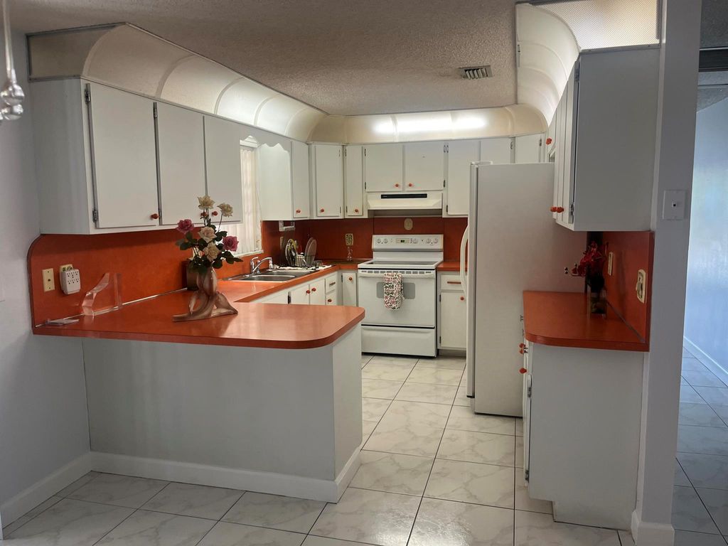 Photo of 820 W Lakewood Road, West Palm Beach, FL 33405 (MLS # R11142421)