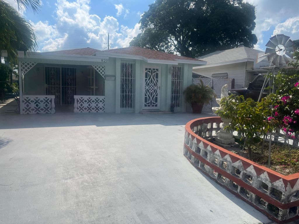 Photo of 820 W Lakewood Road, West Palm Beach, FL 33405 (MLS # R11142421)
